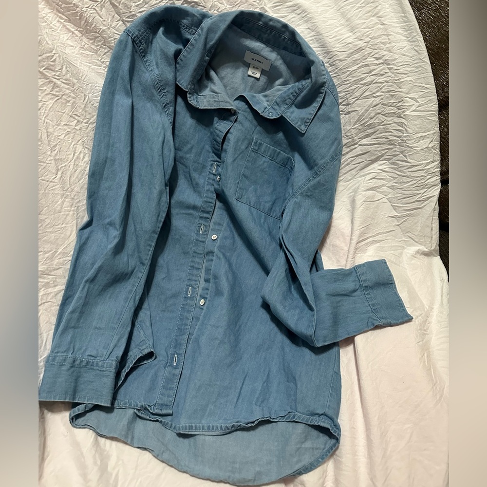 Light blue flannel with white buttons in the front.